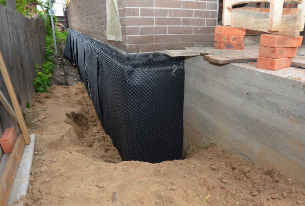 SJ Waterproofing Pros technician performing targeted Vapor Barrier Installation assessment in Riley, IN